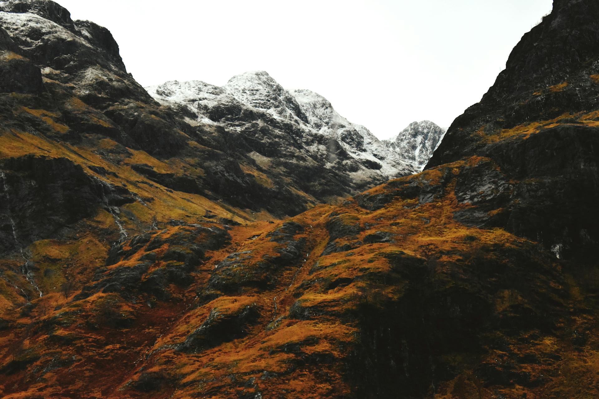 a view of orange and grey mountains
